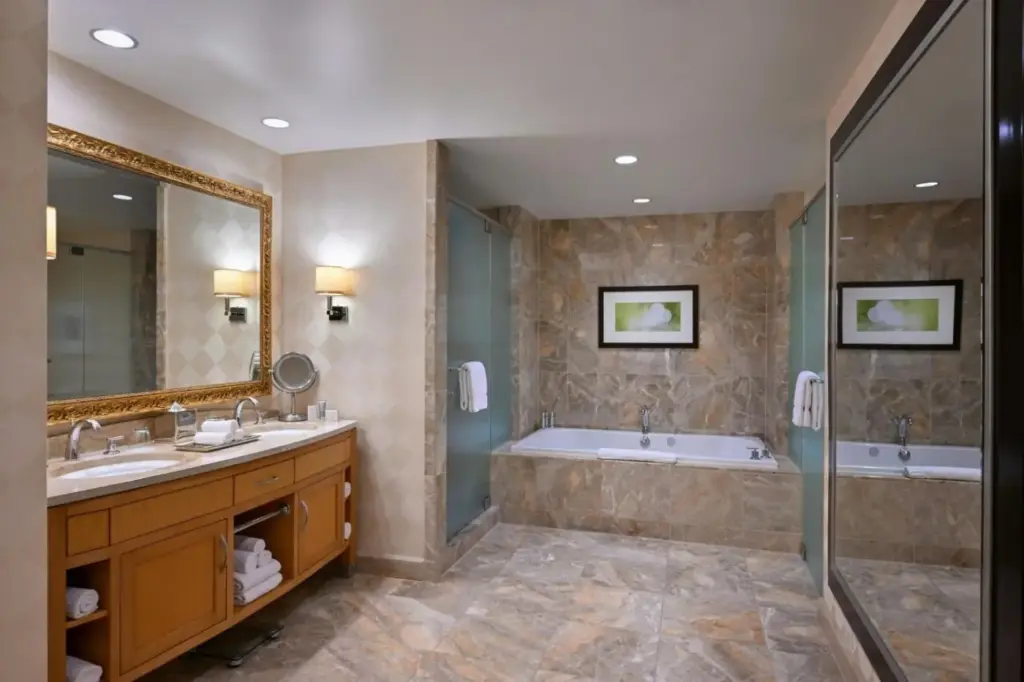 a bathroom with two sinks and a tub and a shower at Trump International Hotel Las Vegas in Las Vegas