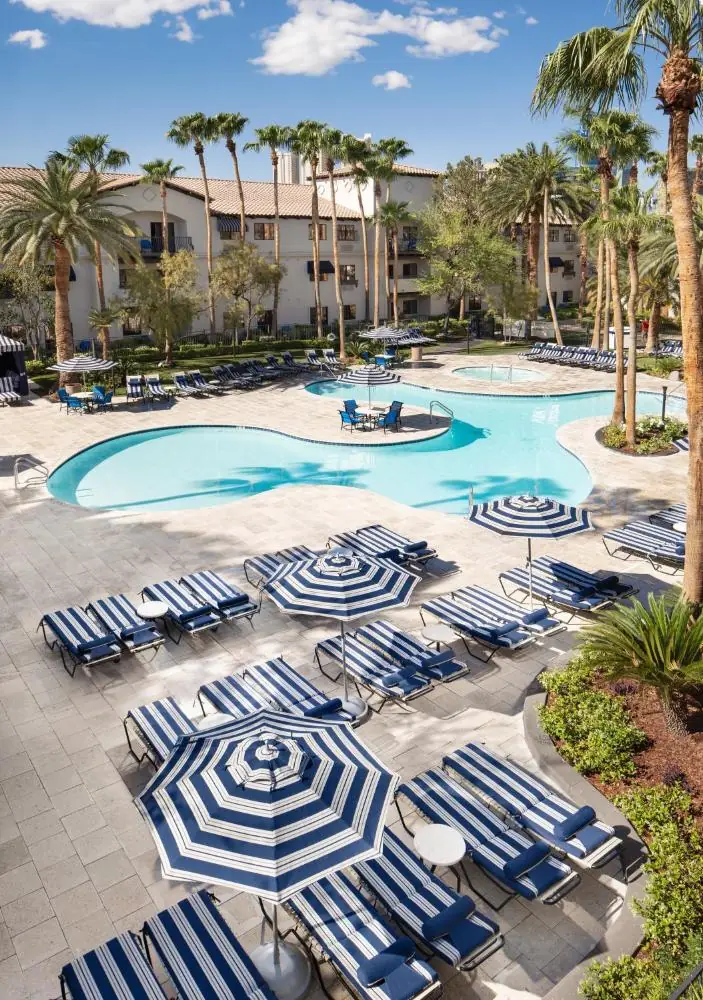 Tuscany Suites outdoor pool and surrounding loungers