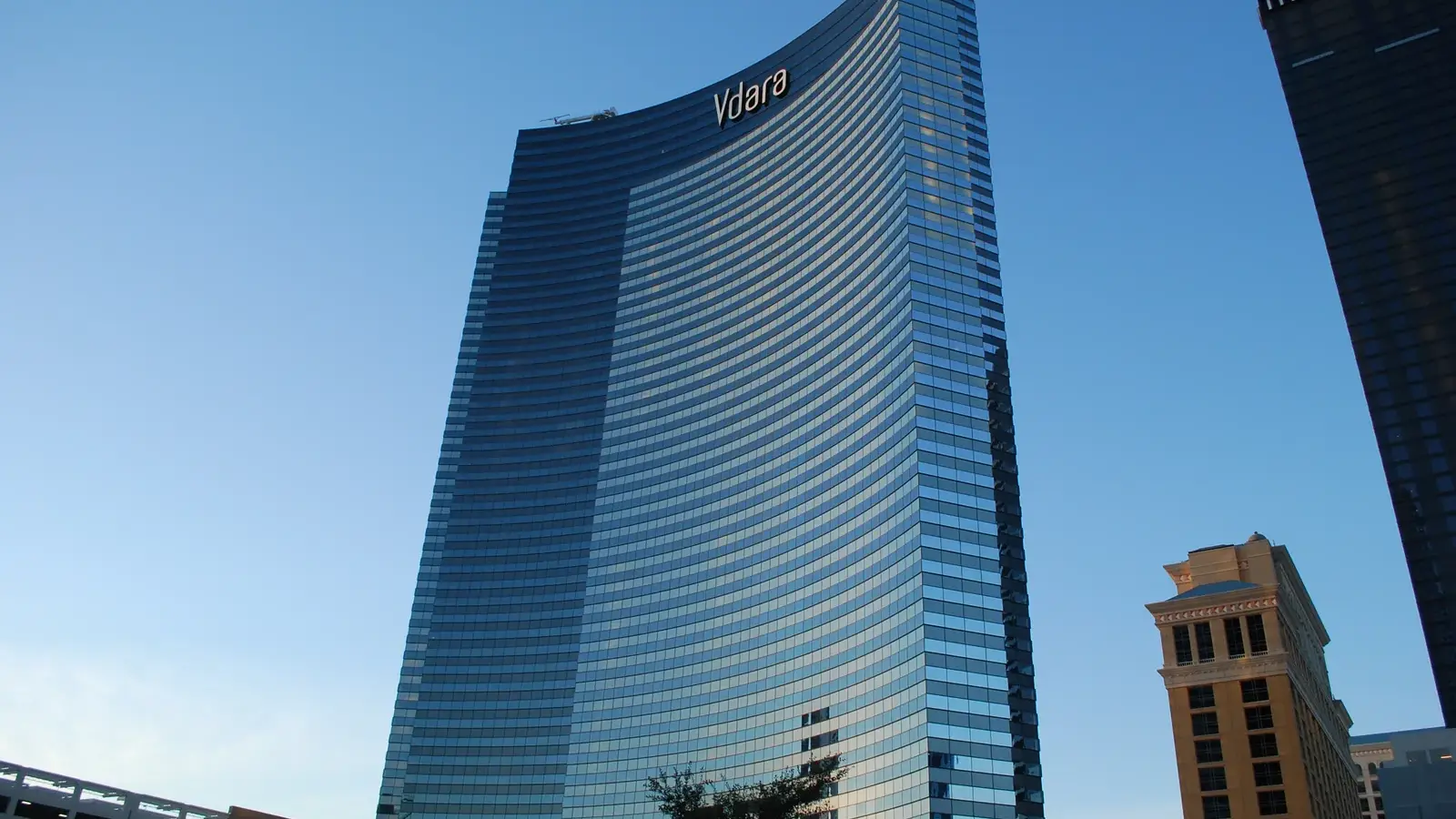 The curved glass Vdara Hotel & Spa tower on the ARIA Campus