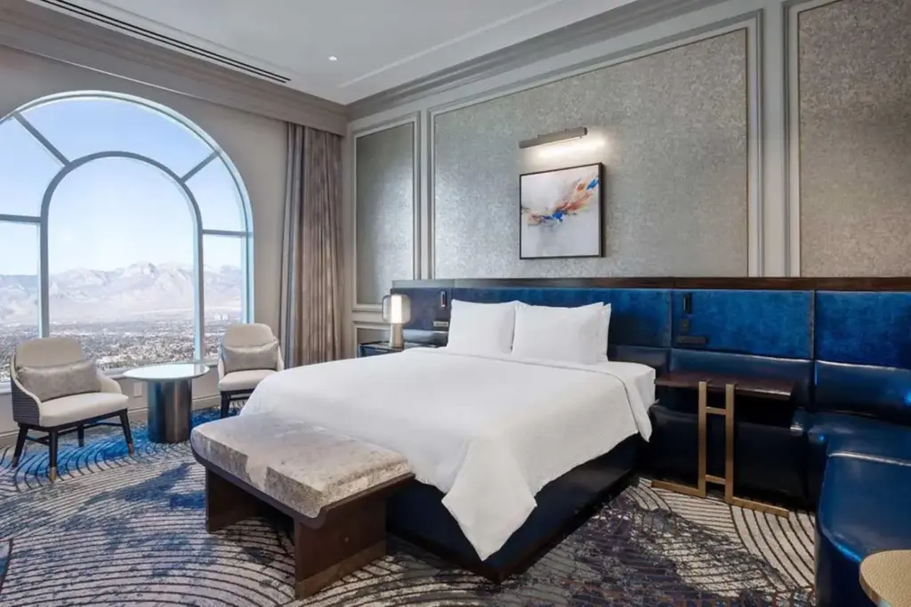 a bedroom with a large bed and a large window at The Venetian® Resort Las Vegas in Las Vegas