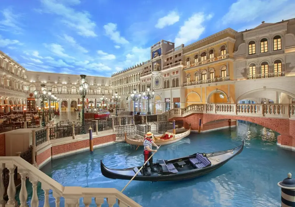 a gondola in a canal in a mall at The Venetian® Resort Las Vegas in Las Vegas