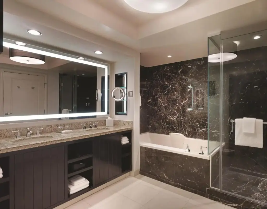 a bathroom with a tub and a sink and a shower at W Las Vegas in Las Vegas