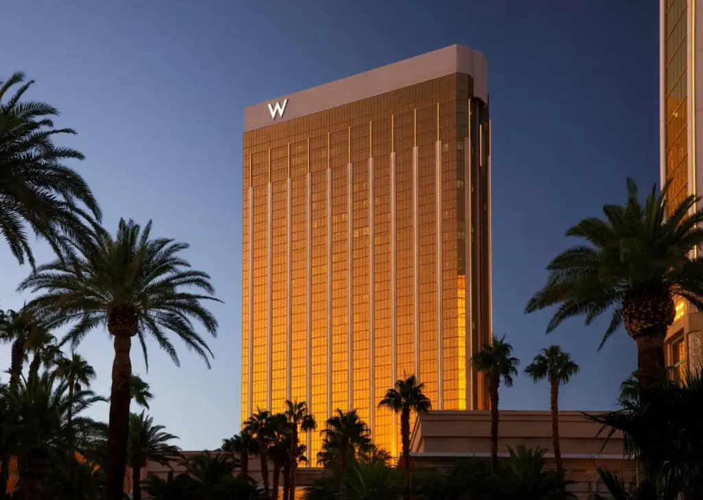 W Las Vegas hotel tower framed by palm trees