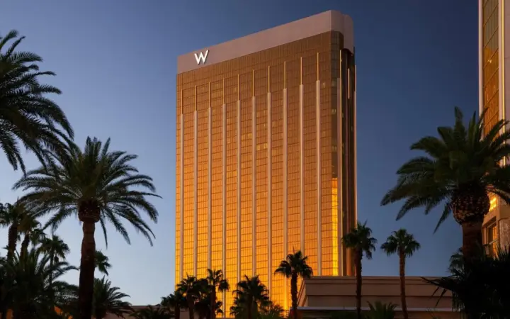 W Las Vegas hotel tower framed by palm trees