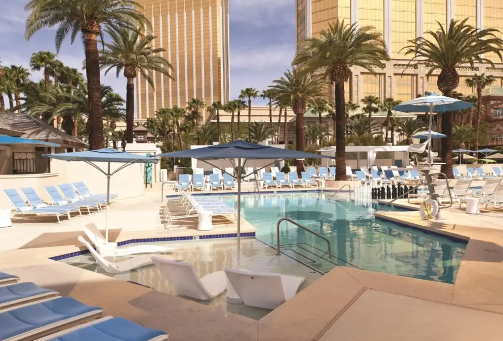 W Las Vegas pool with loungers and palm trees