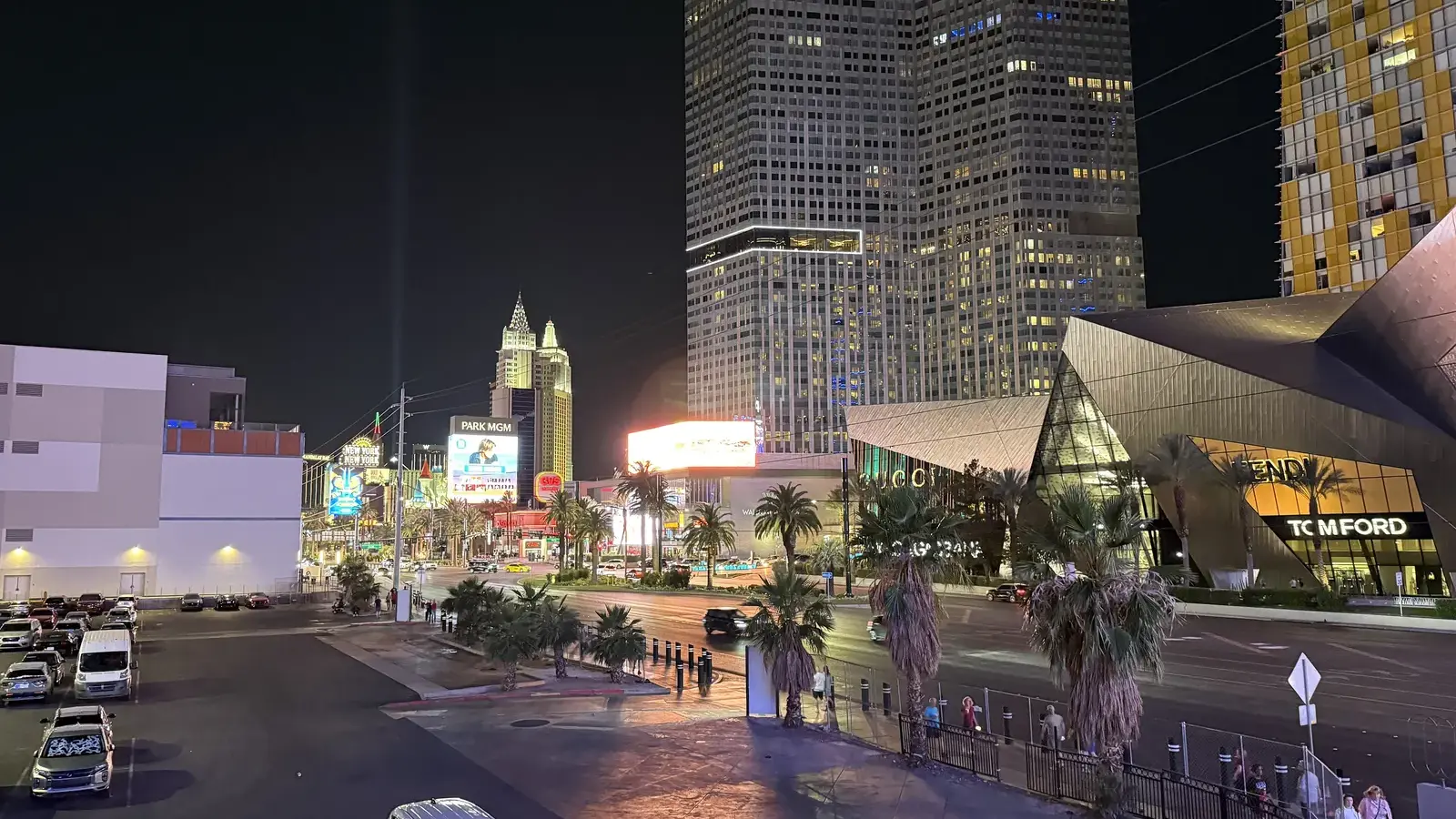 Waldorf Astoria Las Vegas tower at night beside Crystals on the Strip