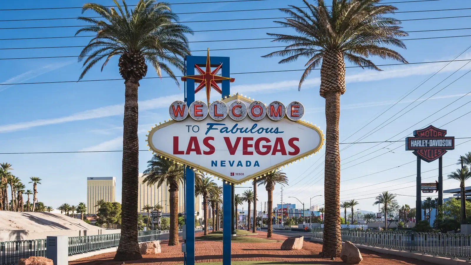 The Welcome to Fabulous Las Vegas sign under palm trees