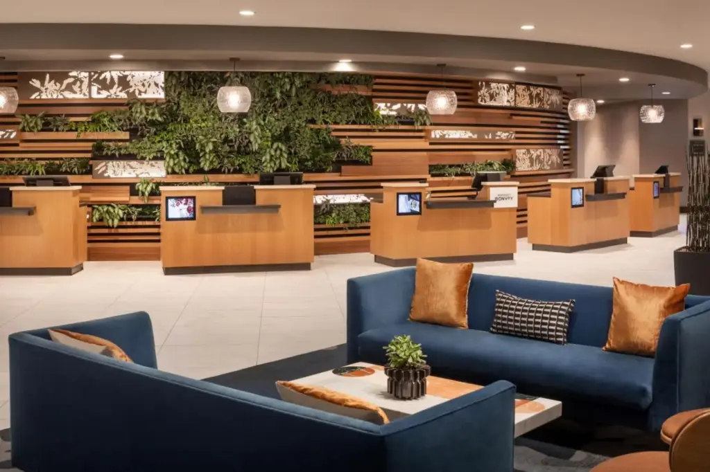 a lobby with blue couches and a waiting room at The Westin Las Vegas Hotel & Spa in Las Vegas