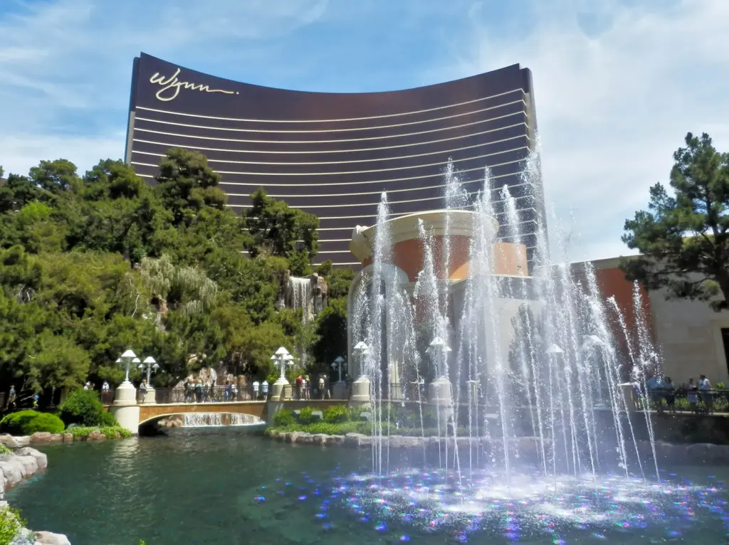 Wynn Las Vegas tower rising behind its lake and fountains