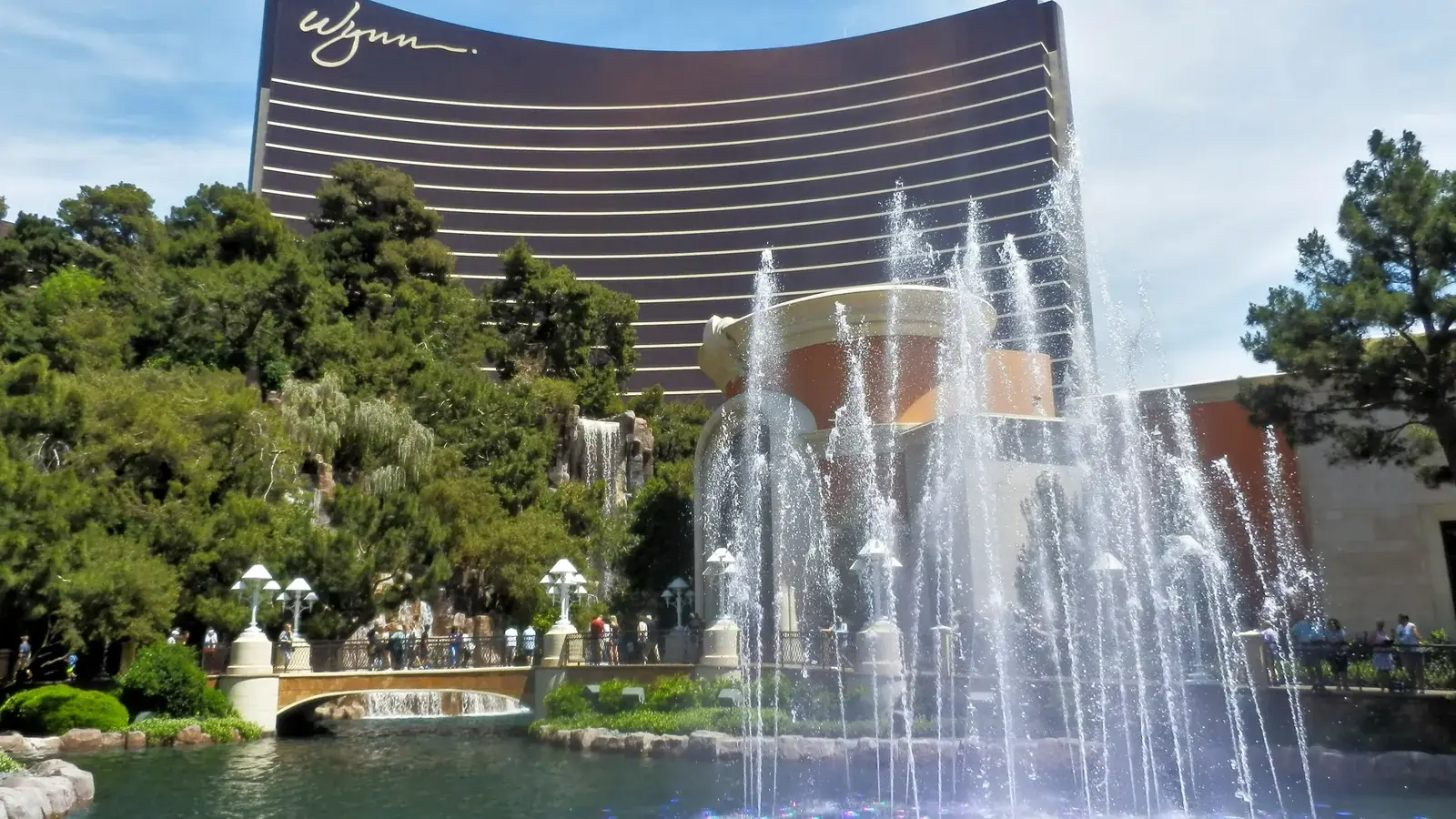 Wynn Las Vegas tower rising behind its lake and fountains