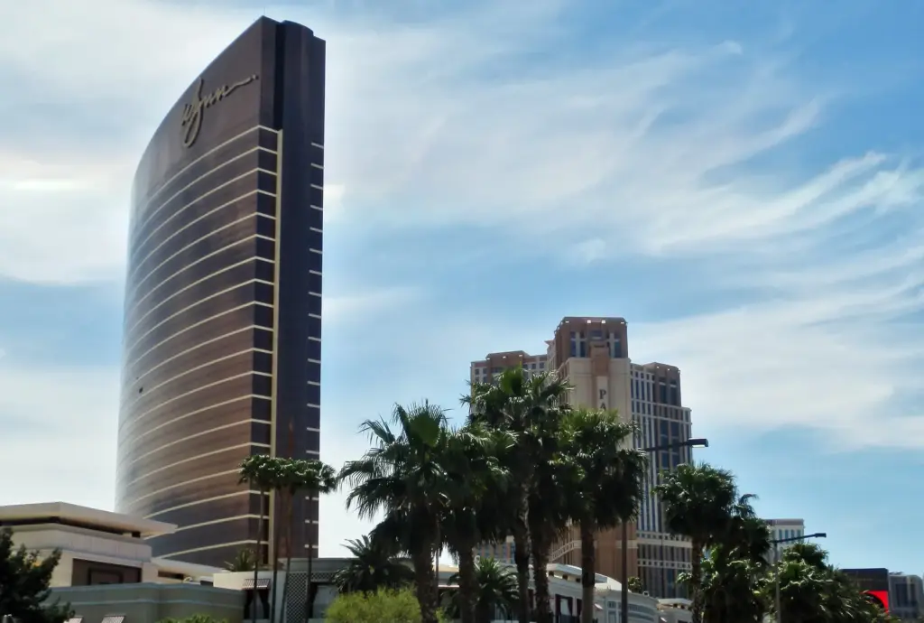 Wynn Las Vegas tower beside the Palazzo tower under a blue sky on the Las Vegas Strip